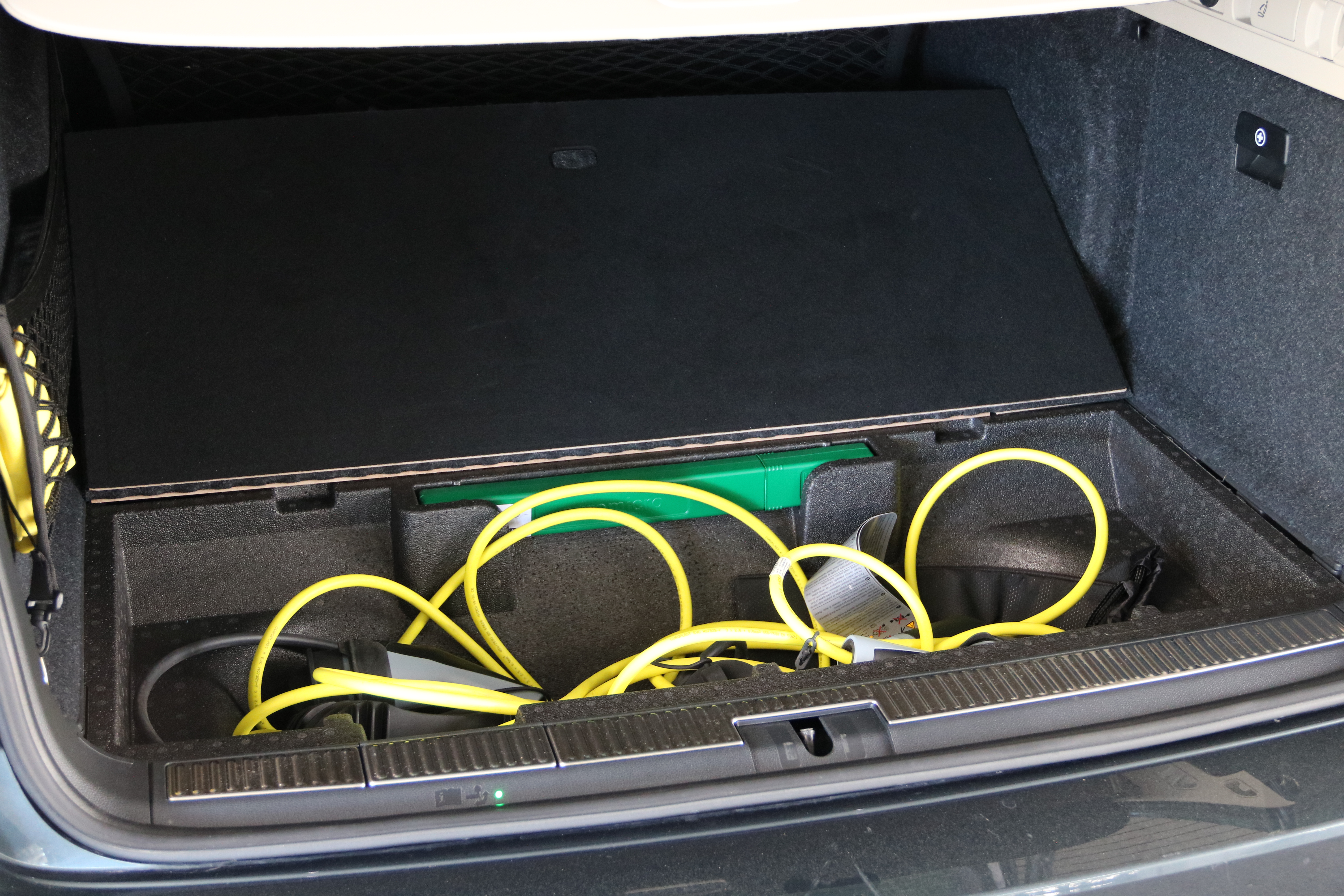 The Skoda Superb iV tailgate has storage space for the charging cable